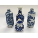 Four miniature blue and white bottles, approx heig