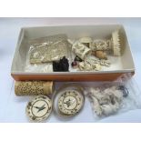 A box containing a collection of ivory items.