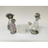 Two Lladro figures in the form of ladies one holdi