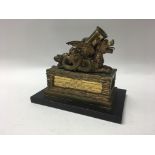 A gilt bronze inkwell and pen stand modelled in th