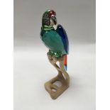 A Swarovski Parrot on a stand approx 23cm in heigh
