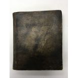 An early velum bound hand written book titled Rule