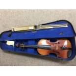 Vintage cased violin and music stand.