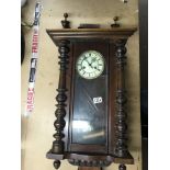 A mahogany veneered Vienna style wall clock.