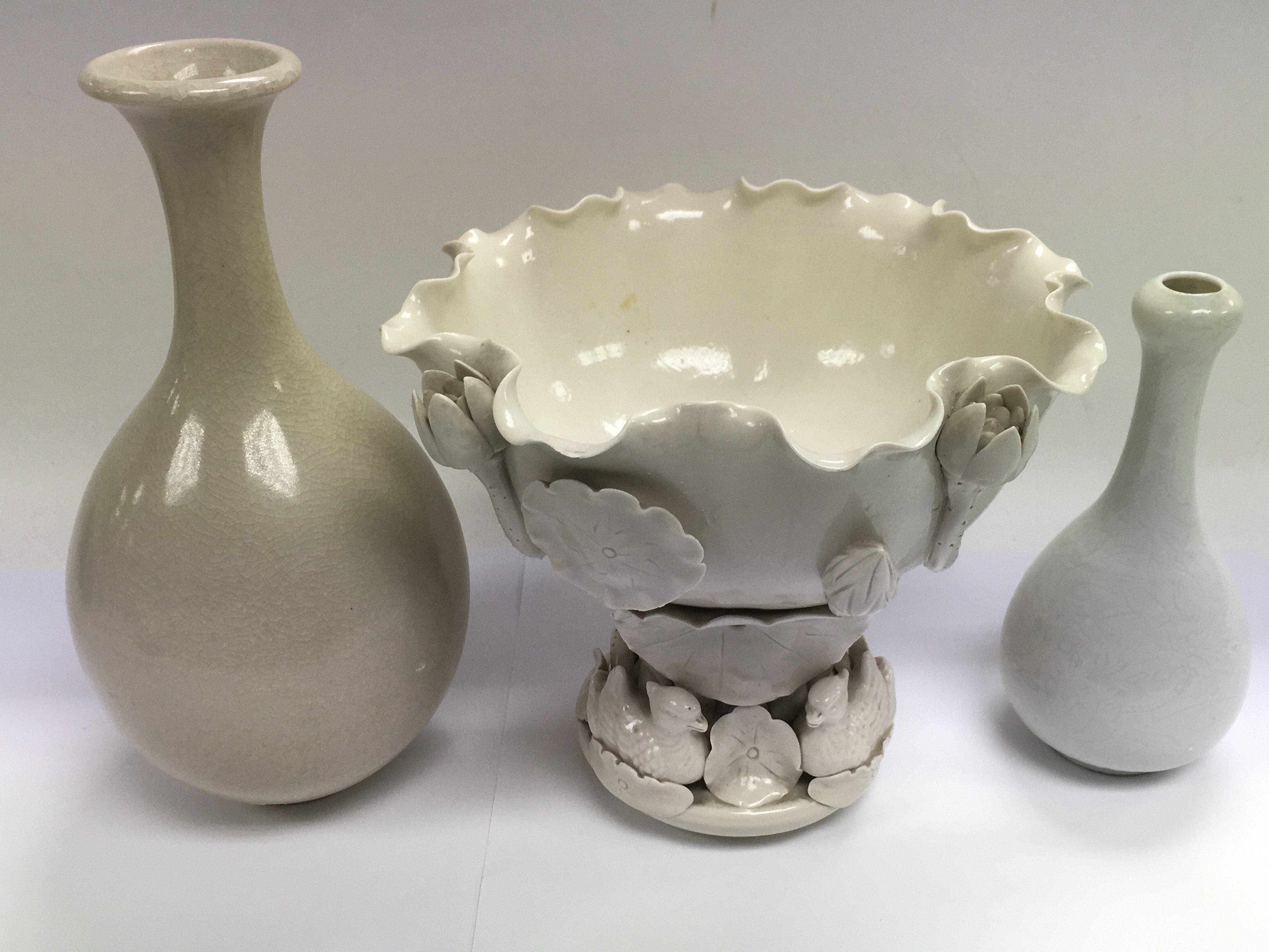 Three white glazed ceramic items including a decor