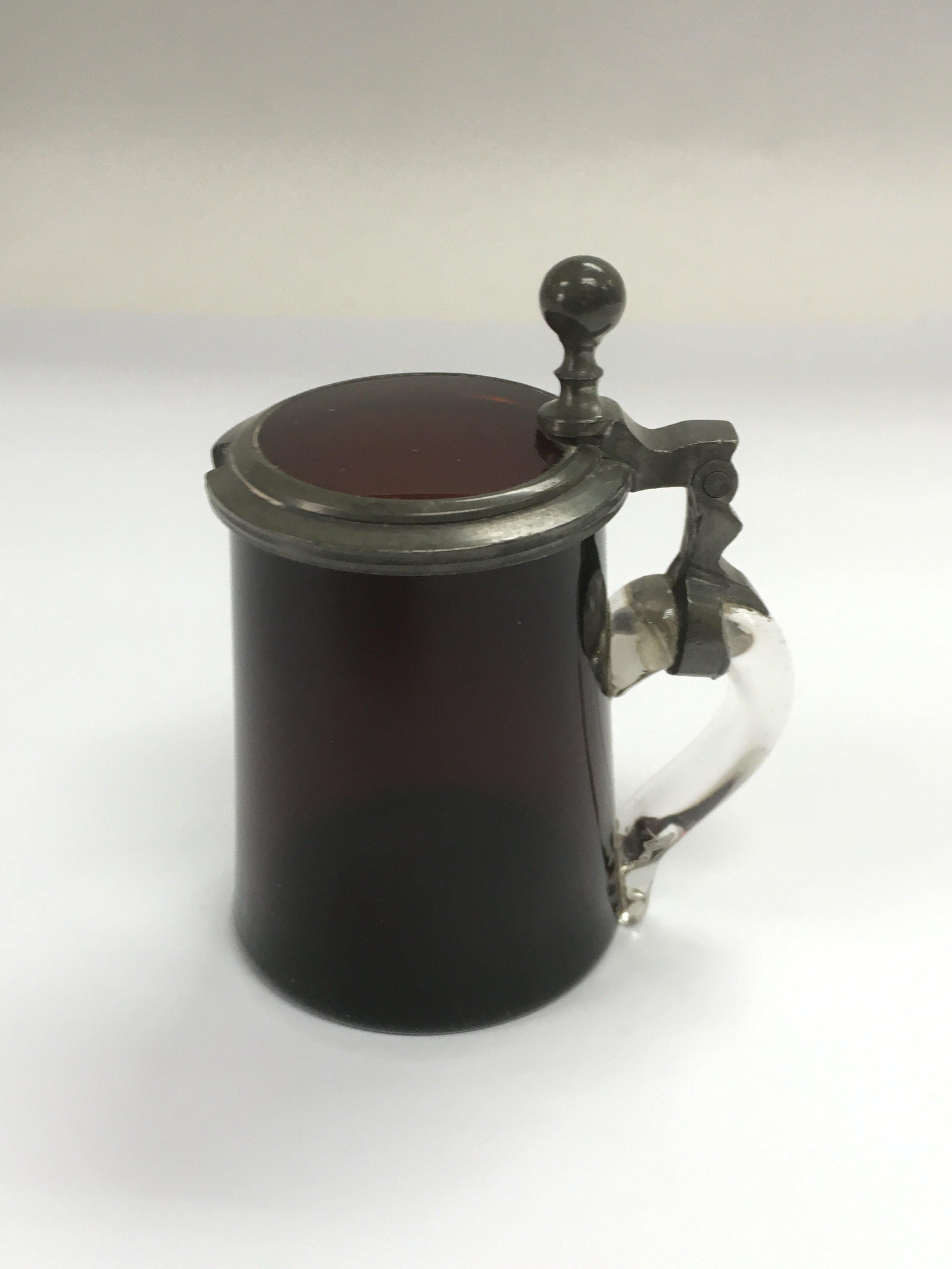 A cranberry glass mustard pot, approx height 8.5cm
