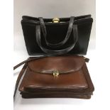 Two vintage leather handbags.