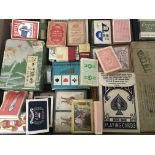 A collection of Vintage playing cards including large Bicycle America cards Martini cards oriental