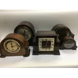 Five vintage mantle clocks.