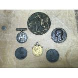 A collection of medals and medallions including George Canning 1827 bronze medallion, WW1 medal,