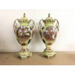 A pair of late 20thC urns and cover with transfer