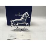 A swarovski stallion figure with box and certifica