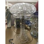 A cut glass side lamp with detachable shade .