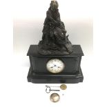 A French 8 day black slate mantle clock surmounted