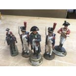 A small collection of soldier figurines including