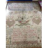 A framed Victorian sampler 30 cm by 42 cm