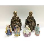 A collection of Oriental figures comprising buddha