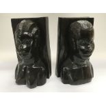 A pair of hardwood carved African tribal bust book