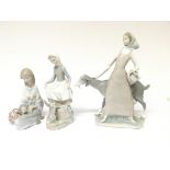 Three Lladro figures in the form of ladies. One kn