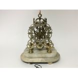 A late 19th century brass Skeleton clock with a pi