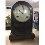 A small mahogany mantle clock by Waterbury clock co. USA.