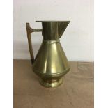 A brass jug in the style and design of Dresser 21
