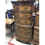 A walnut bow fronted chest on chest of good size w