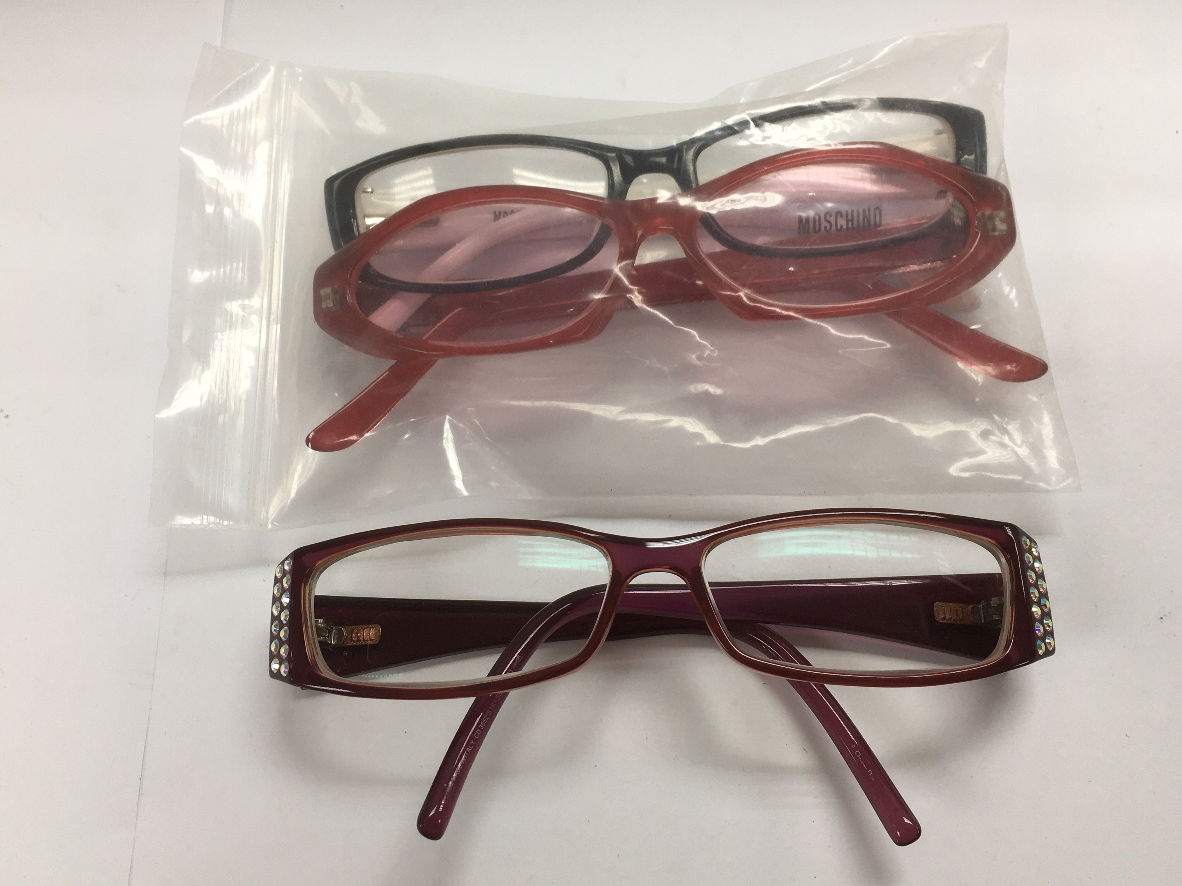 Three pairs of designer glasses comprising two pai