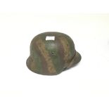 German M35 Combat helmet with rough painted camo,