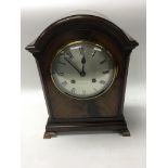 An Edwardian walnut bracket clock. 36cm