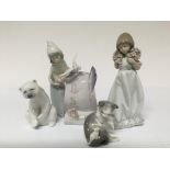 Five Lladro figures. One in the form of a lady hol