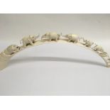 A carved tusk in the form of elephants .60 cm