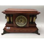 A Victorian Seth Thomas cherry wood pillar clock.