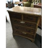 A Small walnut chest of drawers with two short and