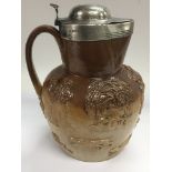 A silver lidded Harvestware jug, possibly Doulton