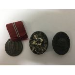 German Wounds badges , silver, solid , black and a