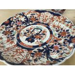 Two Imari plates and a matching vase