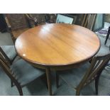 A Modern design G plan circular extending dining table Ravenna design with a set of four matching