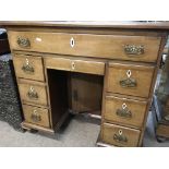 A Georgian mahogany kneehole desk fitted with 8 dr