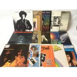 A collection of LPs by various artists including T