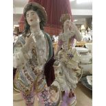 A pair of German porcelain figures in the form of