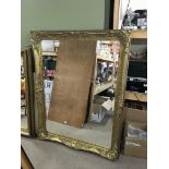 A large ornate gilt framed mirror 142 x 112cm
