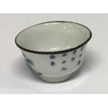 A miniature Chinese Export porcelain bowl the side and base with caricature marks. Hight 2.5cm