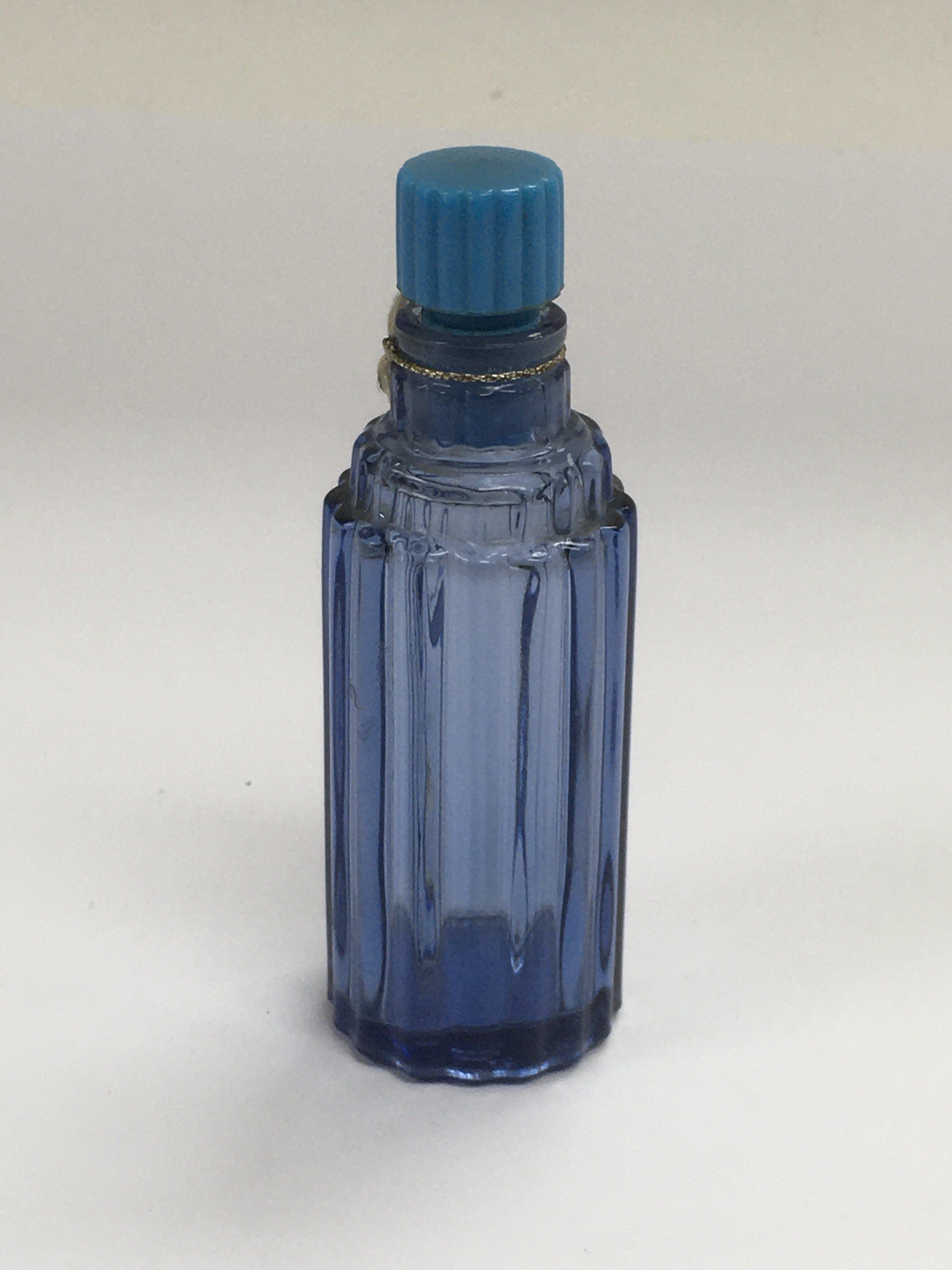 A small Lalique blue glass perfume bottle, approx