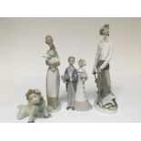 Four Lladro figures. One in the form of a lady hol