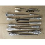 A collection of silver handled button hooks etc.