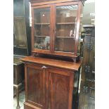 A late Victorian mahogany cabinet with a pair of g