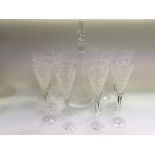 A set of Stuart crystal champagne glasses and deca