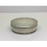 A silver oval lidded box, Birmingham hallmarks, ap