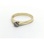 An 18carat gold ring set with a solitaire diamond